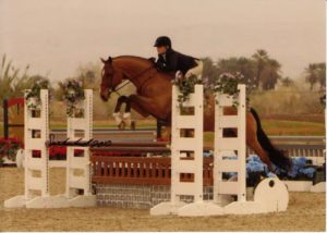 Ashley Pryde and Manhattan owned by Garland Farm Large Junior Hunters 2010 HITS Desert Circuit Photo Flying Horse